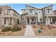 Charming townhome with stone accents and xeriscaped front yard with walkway at 17039 E Exposition Dr, Aurora, CO 80017
