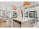 Modern kitchen featuring a large island with quartz countertop, stainless steel appliances, and decorative pendant lighting at 17039 E Exposition Dr, Aurora, CO 80017