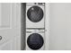 Convenient stacked Samsung washer and dryer unit, neatly tucked behind closet doors at 17039 E Exposition Dr, Aurora, CO 80017