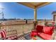 Relaxing back deck with comfortable seating and community views at 12668 Ulster St, Thornton, CO 80602