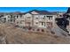 Two-story townhome with private balconies offering scenic views, complemented by well-maintained landscaping at 12668 Ulster St, Thornton, CO 80602
