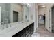 Primary bathroom with double sink vanity, large mirror, and a separate shower and toilet area at 12668 Ulster St, Thornton, CO 80602