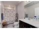 Bathroom featuring a shower with tub combo, a single sink vanity and wood look flooring at 12668 Ulster St, Thornton, CO 80602