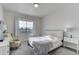 Bright bedroom with large window, cozy decor, and ample natural light at 12668 Ulster St, Thornton, CO 80602
