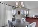 Dining area featuring a modern light fixture, a large window, and views of the outdoors at 12668 Ulster St, Thornton, CO 80602