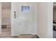 Clean, white entryway featuring a front door with decorative glass and an interior view at 12668 Ulster St, Thornton, CO 80602