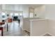Bright foyer with staircase leading to a spacious, naturally lit living area at 12668 Ulster St, Thornton, CO 80602