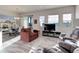 Inviting living room boasts lots of natural light, a fireplace and an open floor plan at 12668 Ulster St, Thornton, CO 80602