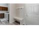Mud room with a bench, coat hooks, and access to laundry room with washer and dryer at 12668 Ulster St, Thornton, CO 80602