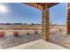 View of a patio with brick columns and an open landscape in the distance at 12668 Ulster St, Thornton, CO 80602