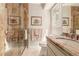 Bathroom featuring glass-enclosed shower, granite vanity and neutral tile flooring at 3720 S Willow Cir, Denver, CO 80237