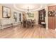 Elegant dining room featuring hardwood floors and a decorative ceiling at 3720 S Willow Cir, Denver, CO 80237