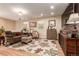 Inviting living room featuring hardwood floors, neutral walls, area rug and windows at 3720 S Willow Cir, Denver, CO 80237