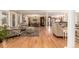 Bright living space with hardwood floors, neutral tones, and ample seating at 3720 S Willow Cir, Denver, CO 80237