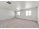 Spacious, carpeted bedroom with multiple windows providing natural light at 18009 Dandy Brush Ln, Parker, CO 80134