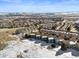 Real estate featuring well-maintained townhomes in a snow-covered landscape and stunning views on a sunny day at 281 Rockview Dr, Superior, CO 80027