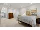 Basement bedroom featuring carpet flooring and a queen-sized bed and sitting chair at 281 Rockview Dr, Superior, CO 80027
