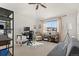 Bedroom featuring a ceiling fan, large window, desk, and comfortable seating at 281 Rockview Dr, Superior, CO 80027