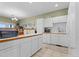 Bright kitchen with white cabinetry and wood countertops at 281 Rockview Dr, Superior, CO 80027