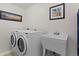 Laundry room featuring a washer, dryer and utility sink with plenty of light at 281 Rockview Dr, Superior, CO 80027
