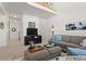 Comfortable living room with a cozy sofa, entertainment center, and access to the second floor at 281 Rockview Dr, Superior, CO 80027