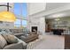 Open living room with fireplace, comfortable seating, and a dining area nearby at 281 Rockview Dr, Superior, CO 80027