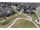 An aerial view of a well-planned residential community with walking paths and modern homes at 1732 Stable View Dr, Castle Pines, CO 80108
