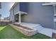 The backyard has a small patio area with an artificial lawn at 1732 Stable View Dr, Castle Pines, CO 80108