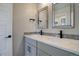 Bright bathroom features double sinks, modern fixtures, and decorative mirrors at 1732 Stable View Dr, Castle Pines, CO 80108