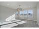 Bright bedroom featuring large windows and a modern light fixture at 1732 Stable View Dr, Castle Pines, CO 80108