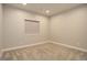 This bedroom has neutral carpeting and a bright window at 1732 Stable View Dr, Castle Pines, CO 80108