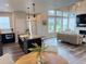 Spacious open-concept kitchen and living area with hardwood floors, ample natural light, and modern finishes at 1732 Stable View Dr, Castle Pines, CO 80108