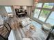 Bright and airy living room featuring hardwood floors, high ceilings, and large windows offering abundant natural light at 1732 Stable View Dr, Castle Pines, CO 80108
