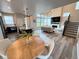 Open-concept kitchen and living area featuring a dining nook and a cozy fireplace at 1732 Stable View Dr, Castle Pines, CO 80108