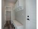 Mud room featuring built-in bench, cubbies, and hooks for convenient storage and organization at 1732 Stable View Dr, Castle Pines, CO 80108