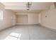 Spacious garage with painted floor, garage door, built in storage area, and exterior access door at 3691 S Joplin St, Aurora, CO 80013