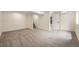 Spacious basement with carpeting and access to a bathroom and stairs at 11510 Otis St, Westminster, CO 80020