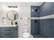 Stylish bathroom with a sleek vanity, and modern tiled shower at 11510 Otis St, Westminster, CO 80020