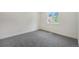 Cozy bedroom with a large window and neutral carpeting at 11510 Otis St, Westminster, CO 80020