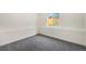 Bright, carpeted bedroom with wainscotting and a large window at 11510 Otis St, Westminster, CO 80020