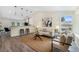 Bright living room with modern lighting, stylish decor, and hardwood floors at 11510 Otis St, Westminster, CO 80020