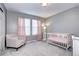 Charming bedroom with neutral decor and pink curtains at 444 N Jamestown Way, Aurora, CO 80018