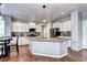 Spacious kitchen featuring granite island and white cabinets at 444 N Jamestown Way, Aurora, CO 80018