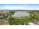Aerial shot of Sloan's Lake, featuring lush parkland, winding roads, and city views at 3522 W 17Th Ave, Denver, CO 80204