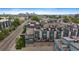 Captivating aerial view of townhomes with rooftop decks, garages, and a glimpse of the city skyline at 3522 W 17Th Ave, Denver, CO 80204
