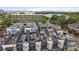 Beautiful aerial view of townhomes with roof top patio furniture and an amazing view of Sloan's Lake at 3522 W 17Th Ave, Denver, CO 80204