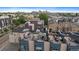 Stunning aerial view showcases Denver cityscape from rooftop patios with lounge areas and outdoor seating at 3522 W 17Th Ave, Denver, CO 80204