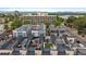 Aerial view of modern townhomes, showcasing rooftop patios with furniture and stunning city views at 3522 W 17Th Ave, Denver, CO 80204