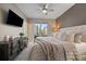 Inviting bedroom featuring natural light, plush bedding, and a dresser at 3522 W 17Th Ave, Denver, CO 80204