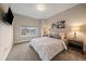 Bright bedroom with a large window, neutral color palette, and mounted TV at 3522 W 17Th Ave, Denver, CO 80204